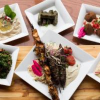 Taste of the Middle East · Serves 2. Two kafta kabobs & two chicken kabobs served on a bed of Basmati rice with humos, ...