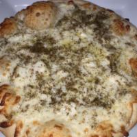 Halloumi and Mozzarrella Pizza · Halloumi cheese with zaatar and mozzarella drizzled with olive oil on a pizza dough