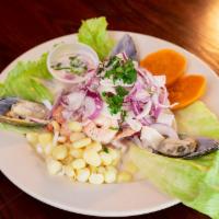 CEVICHE MIXTO · Fresh Gulf Corvina, Shrimp, Calamari, Mussles 
and octopus marinated and cooked in citrus ju...