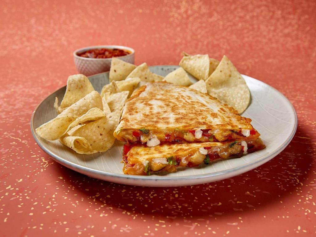 Chicken Club Quesadilla · Served in a grilled 10