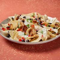 Nachos · Served with your choice of protein along with beans, Moe's famous queso and pico de gallo.