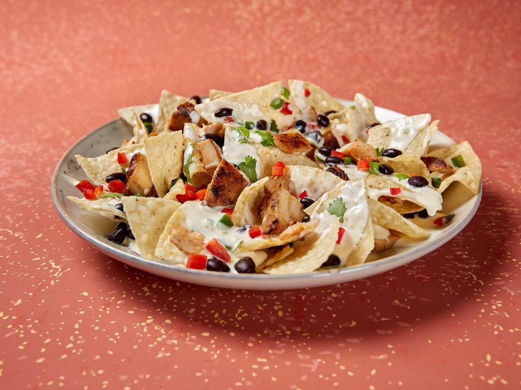 Alright, Alright, Alright Nachos · Served with queso, your choice of beans and pico.