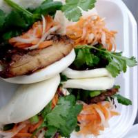 (2) Steamed buns  · Banh bao. 2 steamed rice buns with pickled carrot, scallion cilantro and Hong Kong hoisin sa...