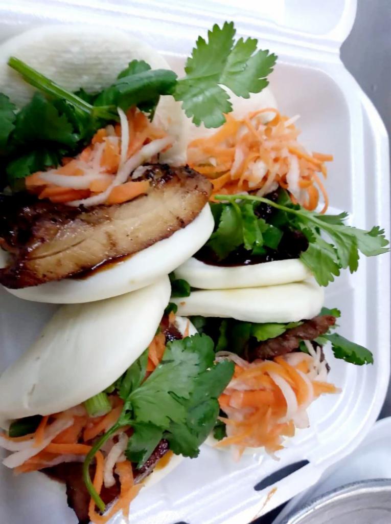 (2) Steamed buns  · Banh bao. 2 steamed rice buns with pickled carrot, scallion cilantro and Hong Kong hoisin sauce. Your choice of pork, beef, chicken, shrimp or tofu.