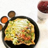 Tostada Bowl · A crispy flour shell filled with rice, beans, your choice of meat, then top it off with any ...