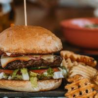 Hatch Chile Burger · Bacon aioli, green chiles, cheddar cheese, pickled red onion, oven-roasted tomatoes, greens,...