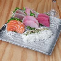 Sashimi Deluxe · 3pcs tuna, 3pcs salmon, 3pcs yellowtail, 3pcs albacore, 3pcs red snapper. Served with white ...