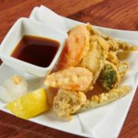 Vegetable Tempura. · Deep Fried Mixed Vegetables with tempura batter.
(8 Pieces)