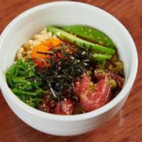 Tuna Poke Bowl. · Tuna, sesame seeds, seaweed salad, avocado, masago, crunchy wonton, green onions, and seawee...