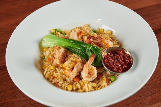Shrimp Fried Rice. · Shrimp, Rice, Egg, Mixed Veggies, Sesame Seeds, and grilled Baby Bok Choy with Fried Chili Oil on the side.