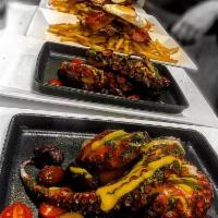 Pulpo · Grilled octopus, Peruvian olives and roasted fingerling potatoes with aji Amarillo reduction.