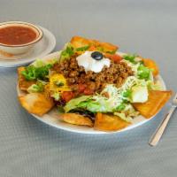 Taco Salad · Ground beef, tomato, shredded cheddar, and Jack cheese and sour cream, served with crispy fl...