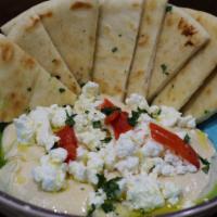 Goat Cheese Hummus & Pita Bread · Our homemade Hummus topped with Goat Cheese and served with warm pita bread 