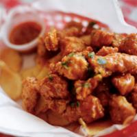 Crispy Chicken Nuggets · 8 to 10 Crispy Nuggets, served with Fries or Chips & a dipping sauce 