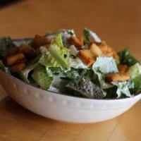 Caesar Salad · Romaine lettuce, homemade Caesar, shredded Parmesan and crispy croutons.