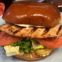 The Classic Sandwich · Grilled or crispy chicken breast on brioche bun with lettuce, tomato, mayo and pickles.