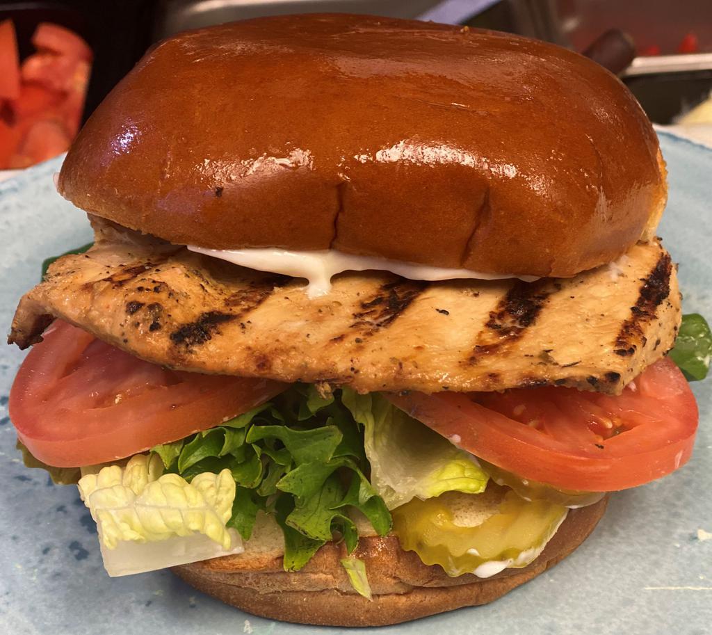 The Classic Sandwich · Grilled or crispy chicken breast on brioche bun with lettuce, tomato, mayo and pickles.
