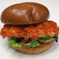 Austin Heat Sandwich · Crispy chicken breast and spicy red pepper sauce on brioche bun with lettuce and pickles.