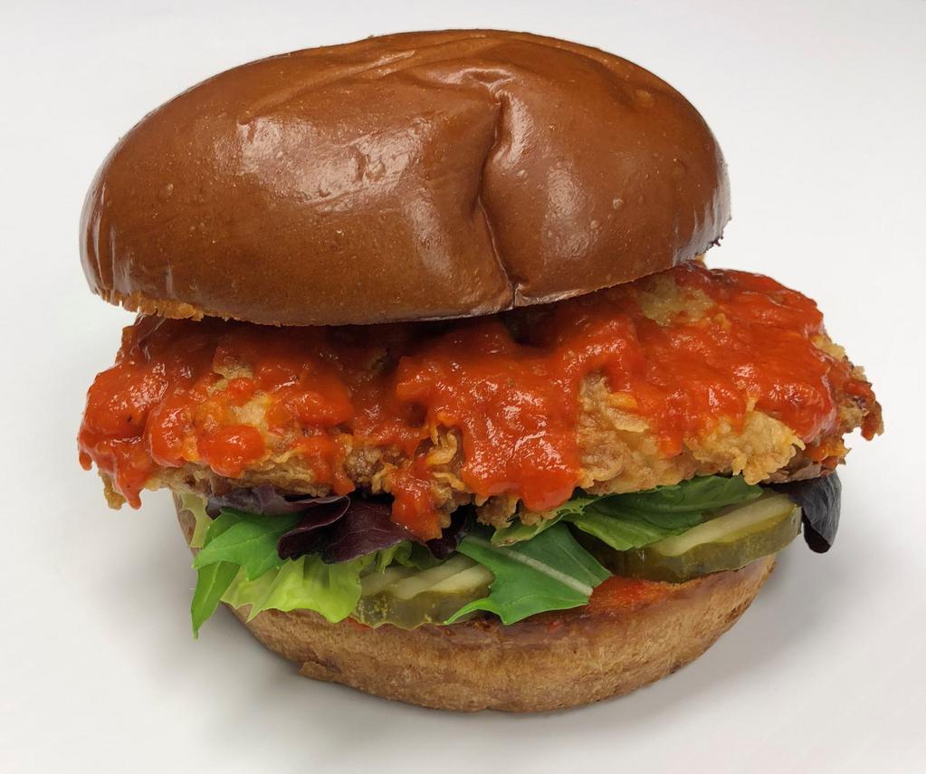 Austin Heat Sandwich · Crispy chicken breast and spicy red pepper sauce on brioche bun with lettuce and pickles.