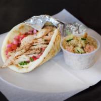 Shawarma Chicken Wrap  · Grilled chicken breast mixed with shawarma seasoning wrapped in pita with hummus, mixed pick...