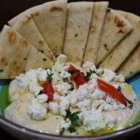 Goat Cheese Hummus & Pita Bread  · Our fresh homemade hummus topped with goat cheese and served with warm pita bread 