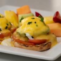 Eggs Benedict · Two poached eggs with canadian bacon topped with hollandaise sauce served on an English muff...