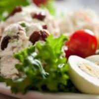 Granny Smith Chicken Salad Platter · Our homemade chicken salad mixed with granny smith apples and raisins, served on a bed of le...