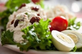 Granny Smith Chicken Salad Platter · Our homemade chicken salad mixed with granny smith apples and raisins, served on a bed of lettuce with tomatoes, a hard-boiled egg, coleslaw and seasonal fresh fruit.