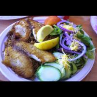 Tilapia Fillet Platter · Freshly grilled to order, served with salad, and dirty rice.