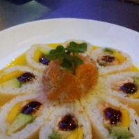 Sunflower Roll · Inside; salmon tempura, mango and avocado, wrapped by yellow soy paper and topped by spicy s...