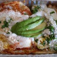 Huevos Rancheros Breakfast · 2 fried eggs between soft corn tortilla smothered in spicy ranchero sauce, Mexican cream, qu...
