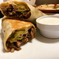 Beef and Lamb Shawarma Wrap · Beef or lamb shawarma and pickles wrapped in a flatbread and toasted on the griddle. Served ...