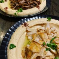Hummus Plate · Choice of chicken, beef or lamb shawarma. Served over a plate of hummus. Served with pita. H...