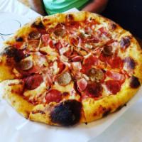 Carnivore Pizza · House-made sausage and meatballs, pepperoni, apple-wood smoked bacon, shredded chicken, and ...