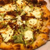 5 Cheese Pesto Pizza · Basil cream sauce, mozzarella, scamorza, Parmigiana, pecorino Romano, ricotta and toasted pi...