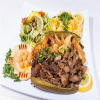 Shawarma Combo · Lamb and chicken shawarma served in thin slices. Served with rice, salad and appetizers.
