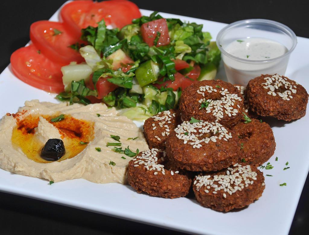 Falafel · Chickpeas, cilantro, onion and garlic, mixed and fried, served with fresh vegetables, tahini sauce, pita and side of hummus. Served with salad and appetizers.