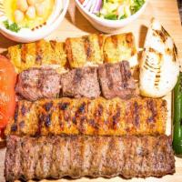Dijla Mix grill · Skewers of lamb kabab, chicken Kabab and iraqi kabab served with rice.