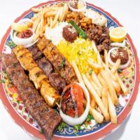 Dijla Combo for 3 · Kabab (lamb), tawook (chicken) and Iraqi kabob, shawarma, hummus. Served with salad.