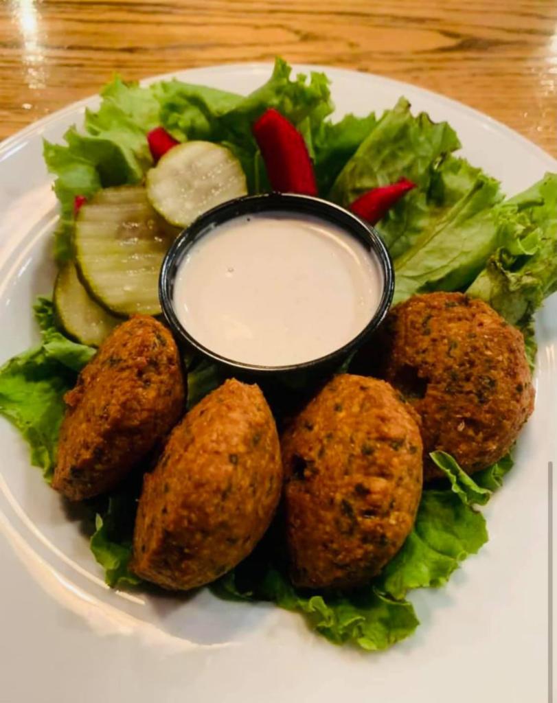 Falafel · Deep fried spiced chic pea and fava bean patties with tahini and garlic sauce.