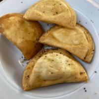 Pierogies · Golden-fried pasta pockets, stuffed with potato and cheese. A Northeast coast favorite.