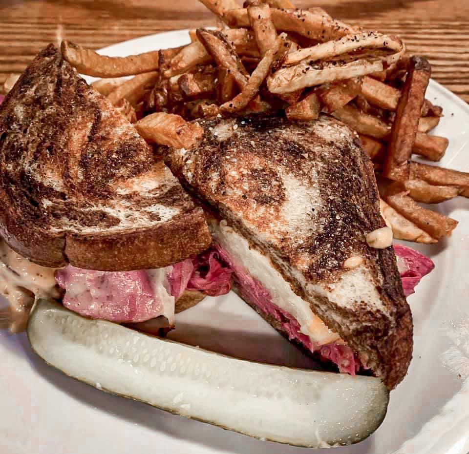 The Legit Reuben · The real deal here. Thin sliced corned beef, sauerkraut, Swiss cheese and Russian dressing on fresh pumpernickel rye.