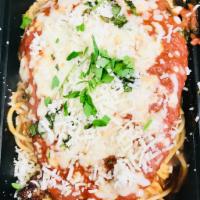 Chicken Parmigiana · Lightly breaded chicken breast topped with mozzarella cheese and marinara sauce, served with...