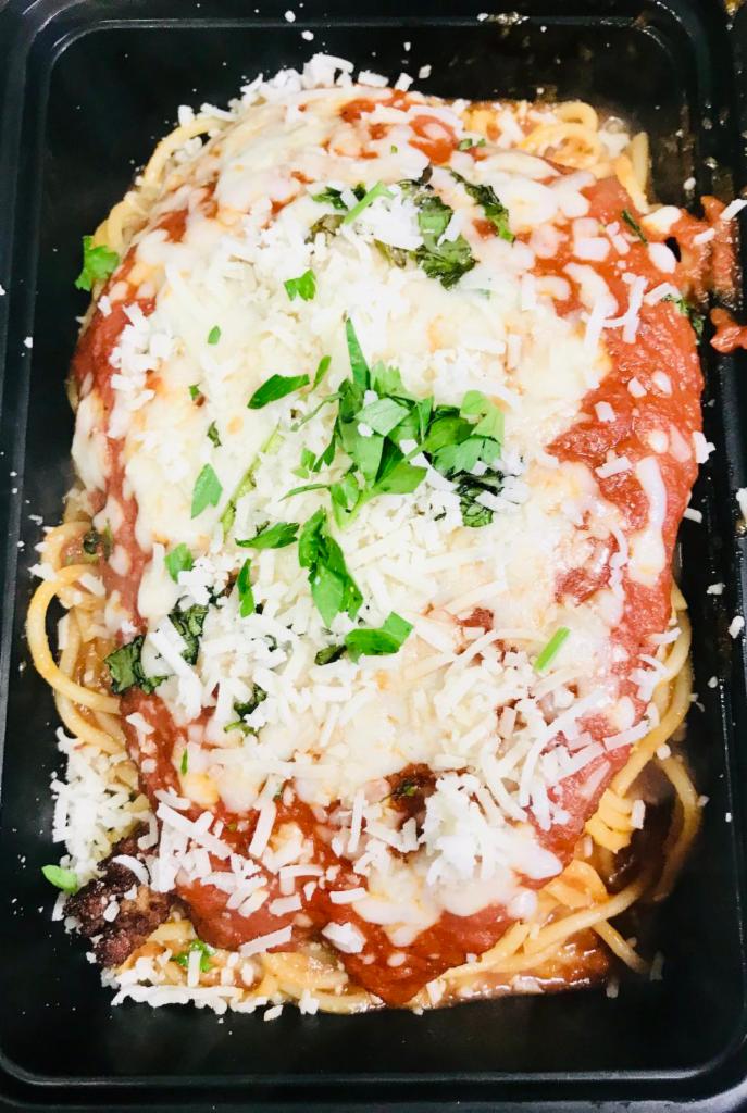 Chicken Parmigiana · Lightly breaded chicken breast topped with mozzarella cheese and marinara sauce, served with a side of spaghetti.