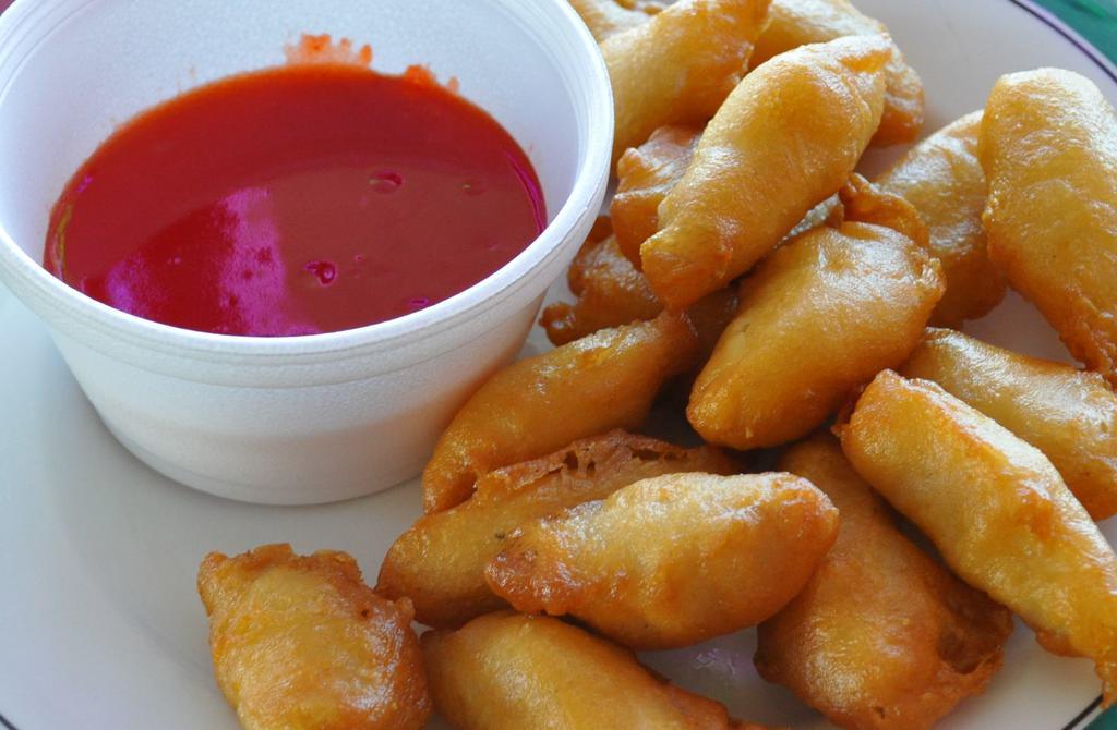 Sweet and Sour Chicken Combination · Sweetened sauce with  vinegar base.