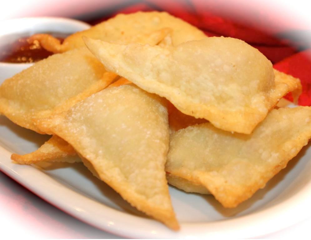 Crab Rangoon  · 6Pc.  Crab meat, scallions and seasoned cream cheese all wrapped up in a wonton, deep-fried and served with a sweet dipping sauce (like duck sauce or sweet and sour sauce). 