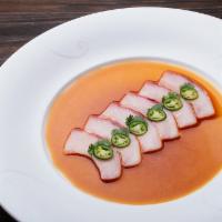 Yellowtail Jalapeno Sashimi · Thinly sliced yellowtail and jalapeno in special sauce.