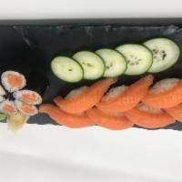 Salmon Sushi · Seven pieces of sushi and one roll. Served with miso soup or garden salad.