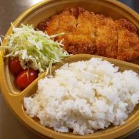 Chicken Katsu (Torikatsu) · Cutlet with shredded cabbage, rice & your choice of sauce on the side.