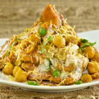 Samosa Chat · Crispy patties topped with chickpeas, chopped onion, whipped yogurt, tangy tamarind sauce, m...